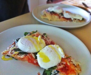 Sardinian breakfast. Tomato passata, parmesan, basil, pane di musica, poached eggs
