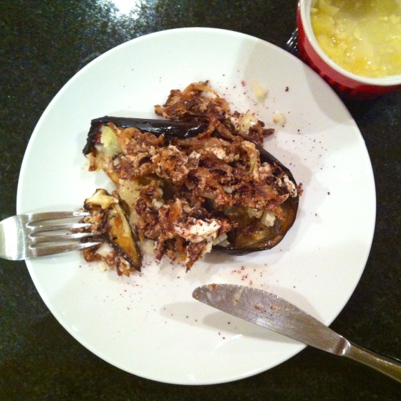 Roasted eggplant with fried seasoned onion and garlicky lemon sauce
